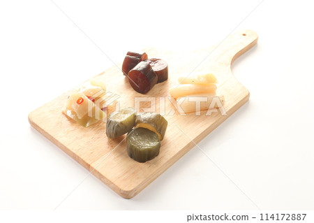 Pickles from Okabe-cho, Fukaya City: green onions, cucumbers, and zha cai on a chopping board 114172887