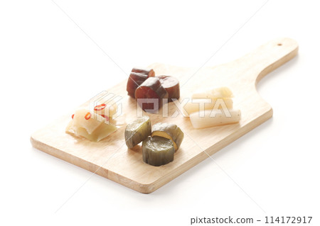 Pickles from Okabe-cho, Fukaya City: green onions, cucumbers, and zha cai on a chopping board Pickles from Okabe-cho, Fukaya City: green onions, cucumbers, and zha cai on a chopping board 114172917