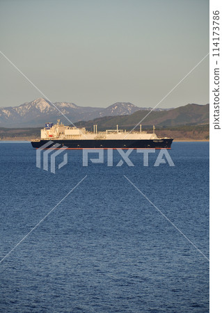Spring morning scene of a large cargo ship sailing through Hakodate Bay in Hakodate, Hokkaido Spring morning scene of a large cargo ship sailing through Hakodate Bay in Hakodate, Hokkaido 114173786
