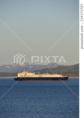 Spring morning scene of a large cargo ship sailing through Hakodate Bay in Hakodate, Hokkaido 114173787