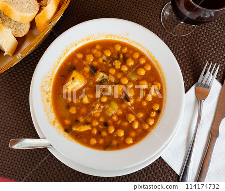 Chickpea stew served with cod fish Chickpea stew served with cod fish 114174732