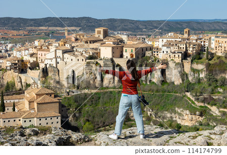 Woman tourist with photo camera, Cuenca, Spain 114174799
