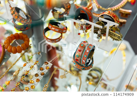 Various adornments on showcase in bijouterie shop 114174909