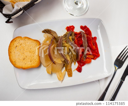 Festive and everyday vegetable dish of Catalan cuisine is escalibada with salted anchovies Festive and everyday vegetable dish of Catalan cuisine is escalibada with salted anchovies 114175385