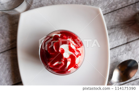 Sweet dessert strawberry mousse whipped to delicate foam is served in small bowl for breakfast. Sweet dessert strawberry mousse whipped to delicate foam is served in small bowl for breakfast. 114175390