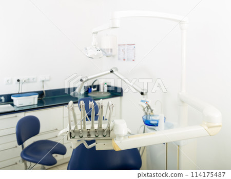 Modern dentist room. Dentist office with modern equipment. Medicine equipment clodeup Modern dentist room. Dentist office with modern equipment. Medicine equipment clodeup 114175487