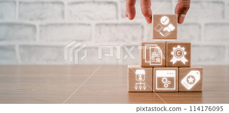 Intangible assets concept, Hand holding wooden block on desk with intangible assets icon on virtual screen. 114176095