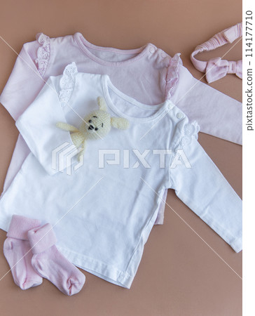 Set of pink clothes and accessories for newborn baby. Knitted toys rabbit and dog, romper, socks and handband Set of pink clothes and accessories for newborn baby. Knitted toys rabbit and dog, romper, socks and handband 114177710