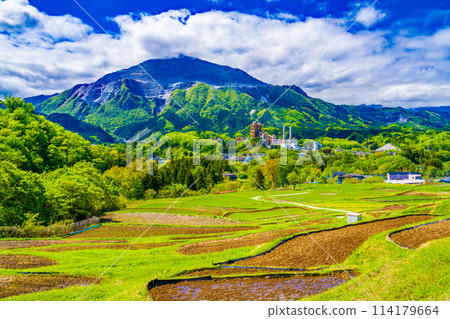 Mount Bukō in spring as seen from Terasaka rice terraces Mount Bukō in spring as seen from Terasaka rice terraces 114179664