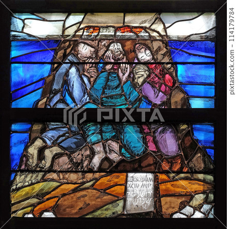 God begins salvation in this world through His Son Jesus Christ, detail of stained glass window by Sieger Koder in St. John church in Piflas, Germany God begins salvation in this world through His Son Jesus Christ, detail of stained glass window by Sieger Koder in St. John church in Piflas, Germany 114179784