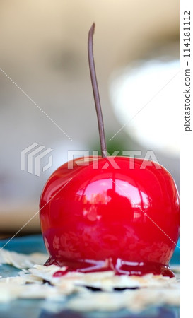 appetizing sweet piece of cake on a plate is eaten with a spoon. selective focus. sweet dessert for breakfast. cake with icing and decorated with berries 114181112