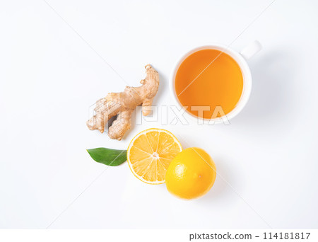 Creative layout of fresh tea with lemon and ginger on a white background. Creative layout of fresh tea with lemon and ginger on a white background. 114181817