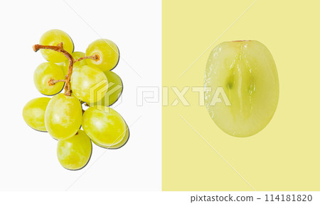 Creative flat lay made of bunch green grapes and cut grape macro on white and green background 114181820