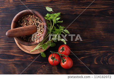 Healthy food. Fresh aromatic basil, tomato and spicy pepper on wood plate Healthy food. Fresh aromatic basil, tomato and spicy pepper on wood plate 114182072