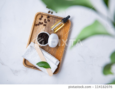 Flat lay with natural ingredients for home body coffee scrub with coffee beans Flat lay with natural ingredients for home body coffee scrub with coffee beans 114182076