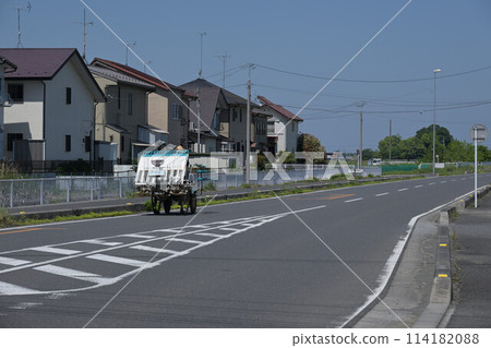 Agricultural machinery running on the road Agricultural machinery running on the road 114182088