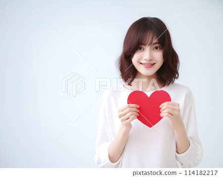 A smiling woman with a heart 114182217