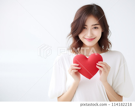 A smiling woman with a heart 114182218