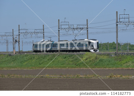 Tobu Nikko Line, express train, Liberty, running along an embankment in the countryside Tobu Nikko Line, express train, Liberty, running along an embankment in the countryside 114182773