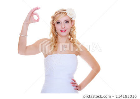 Happy bride in white dress showing a ok sign Happy bride in white dress showing a ok sign 114183016