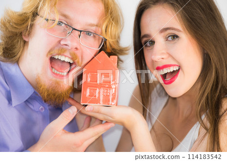 Happy couple buying new house Happy couple buying new house 114183542