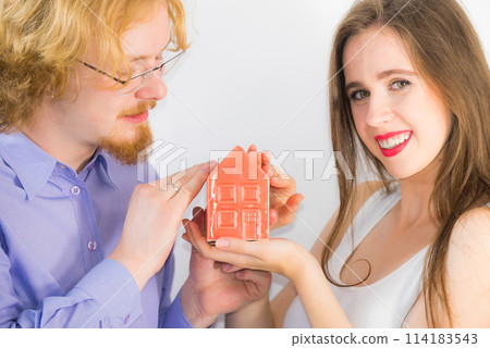 Happy couple buying new house Happy couple buying new house 114183543