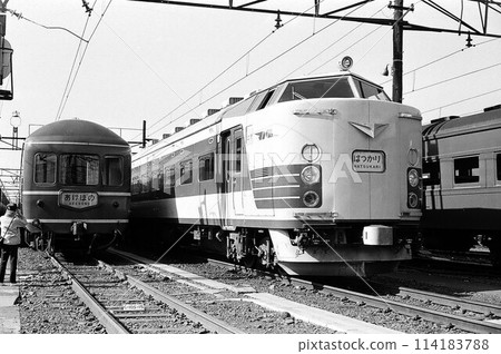 A 20 series passenger car (Akebono) and a 583 series train (Hatsukari) parked at the depot A 20 series passenger car (Akebono) and a 583 series train (Hatsukari) parked at the depot 114183788