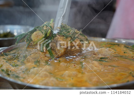 Korean traditional food. Pork Back-bone Stew is a thick traditional Korean food made with pork spine, potatoes, and various vegetables. Korean traditional food. Pork Back-bone Stew is a thick traditional Korean food made with pork spine, potatoes, and various vegetables. 114184032