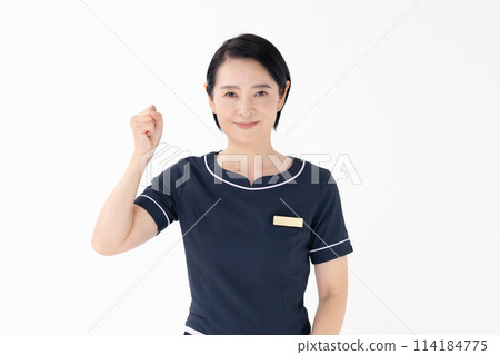 Middle-aged woman, esthetician, uniform, fist pump 114184775