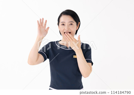 Middle-aged woman, esthetician, uniform, surprised 114184790