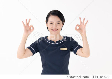 Middle-aged woman, beautician, uniform, OK Middle-aged woman, beautician, uniform, OK 114184820
