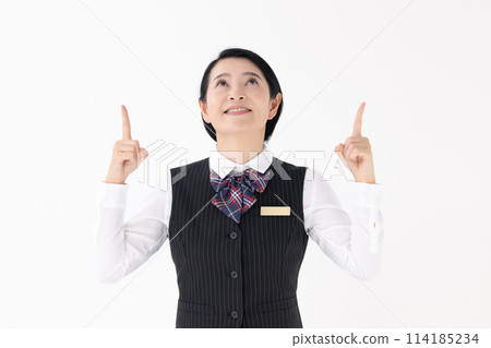 Middle-aged woman in uniform pointing Middle-aged woman in uniform pointing 114185234