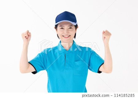 Middle-aged woman in uniform poses 114185285
