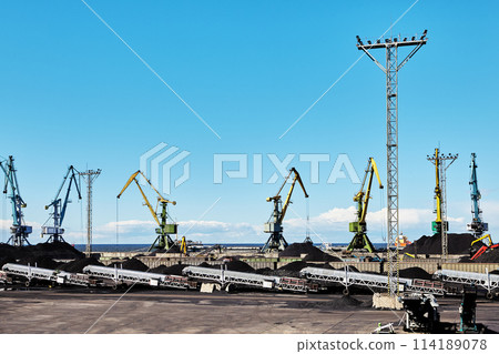 Mobile stacker radial telescopic conveyors in coal harbor of ocean terminal. Mobile stacker radial telescopic conveyors in coal harbor of ocean terminal. 114189078