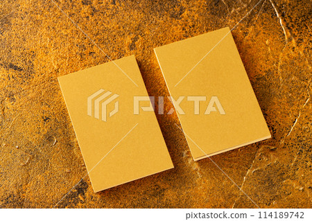 Mockup of two vertical golden foil business cards at golden textured luxury background. 114189742