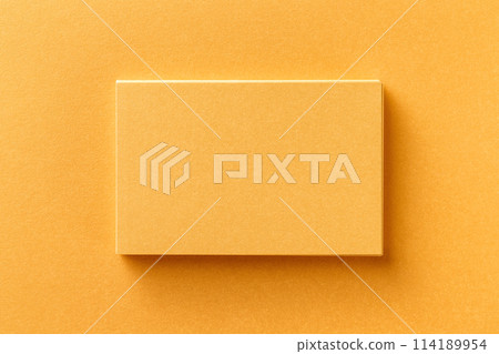 Mockup of horizontal business card stack at golden foil paper background. 114189954