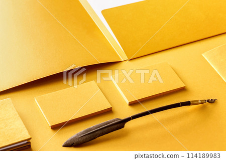 Corporate stationery set mockup. Presentation folder, letterhead and business cards at golden textured foil paper background. 114189983