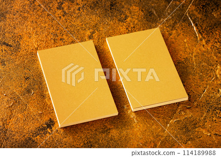 Mockup of two veritcal golden foil business cards at golden textured luxury background. Mockup of two veritcal golden foil business cards at golden textured luxury background. 114189988