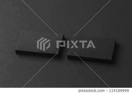 Mockup of two blank business cards stacks at black textured background. Mockup of two blank business cards stacks at black textured background. 114189999