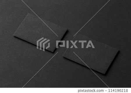 Mockup of two blank business cards at black textured background. Mockup of two blank business cards at black textured background. 114190218