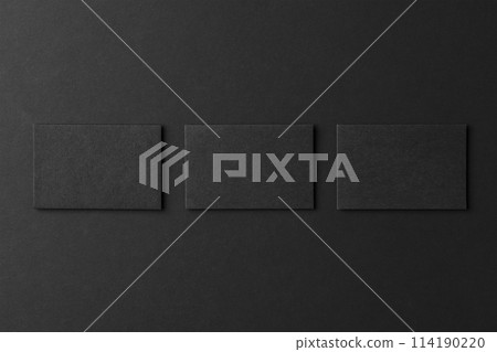 Mockup of three blank business card stacks at black textured background. Mockup of three blank business card stacks at black textured background. 114190220