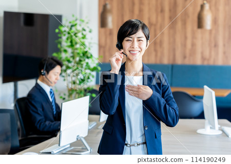 Businessman working in a call center 114190249