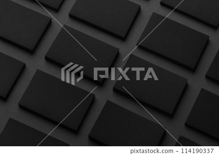 Mockup of horizontal business cards stacks arranged in rows at black textured paper background. Mockup of horizontal business cards stacks arranged in rows at black textured paper background. 114190337