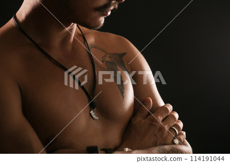 Strong Athletic Sexy Muscular Man on Black Background Strong Athletic Sexy Muscular Man on Black Background 114191044