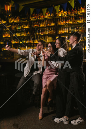 Meeting guys and girls after work in stylish restaurant 114191309