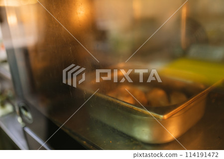 Delightful process of baking pastry in oven in kitchen 114191472