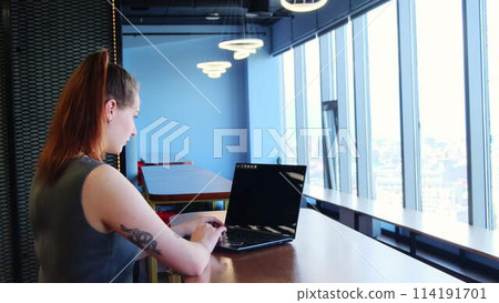 Employee checks significant document at shared workspace Employee checks significant document at shared workspace 114191701