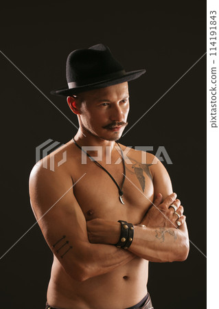 Strong Athletic Sexy Muscular Man on Black Background Strong Athletic Sexy Muscular Man on Black Background 114191843