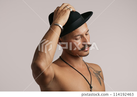 Strong Athletic Sexy Muscular Man on Black Background 114192463