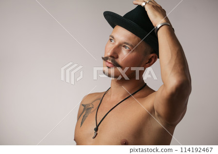 Strong Athletic Sexy Muscular Man on Black Background Strong Athletic Sexy Muscular Man on Black Background 114192467